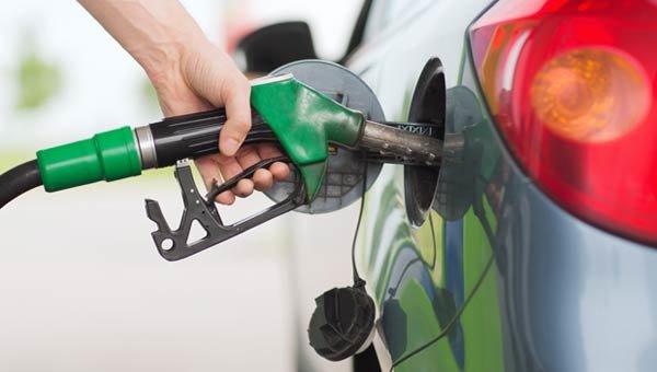 Vehicle being refuelled at a gas station